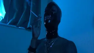 Mistress Kiana smoking in rubber latex mask