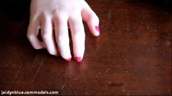 Tapping Pink Nails On Wood