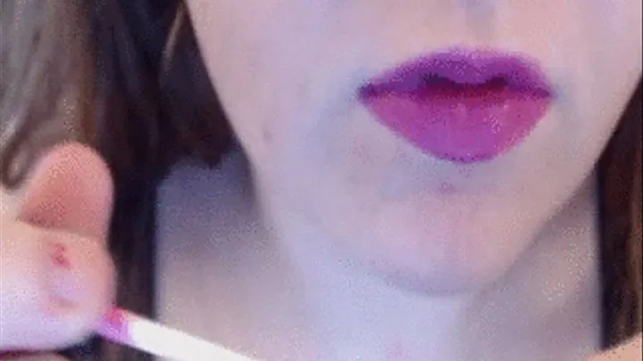 Putting on purple lipstick and glossing my full, pretty lips.