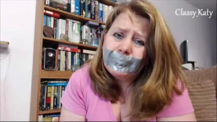 Trying to talk with mouth taped with silver duct tape.