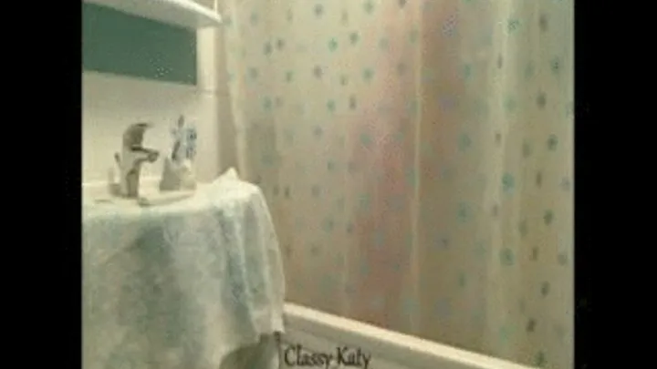 Showering...all you really get to see though is the shower curtain!