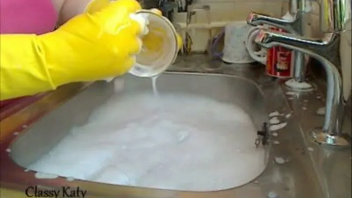 Squeaky clean! Rubber glove washing up of glasses & mugs