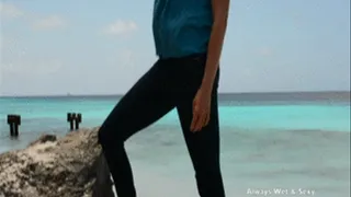 Isabella wears jeans at the beach