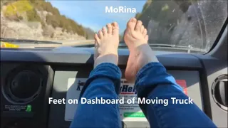 Feet on Dashboard of Moving Truck