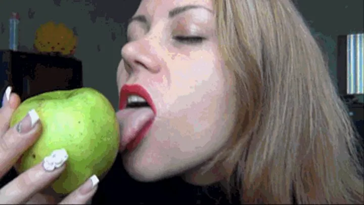 Lipstick marks and lip tease on a green apple a