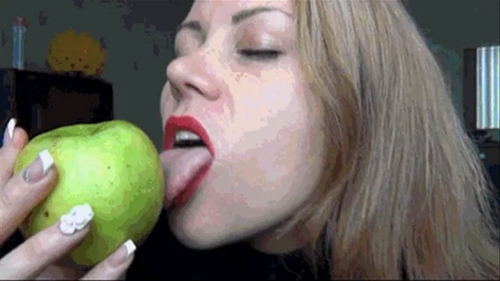Lipstick marks and lip tease on a green apple d