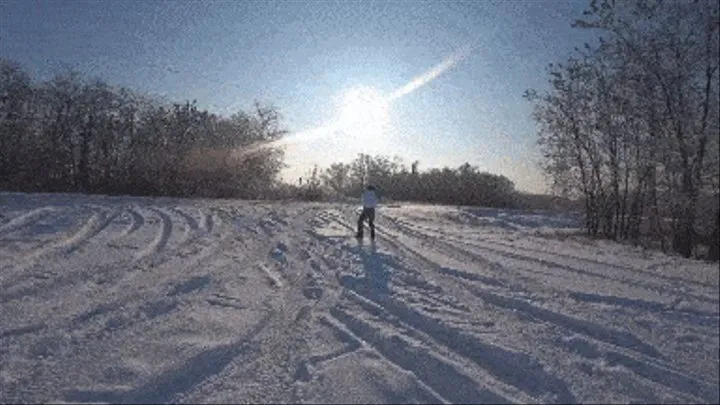 stuck in the snow in an orange car b