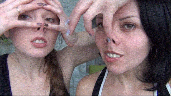 Two beautiful girls play with the nose Lb