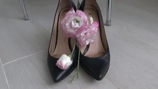 She crushed beautiful flowers with black leather shoes c