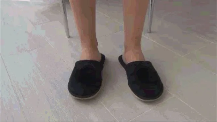 Toe tapping in black plush slippers d