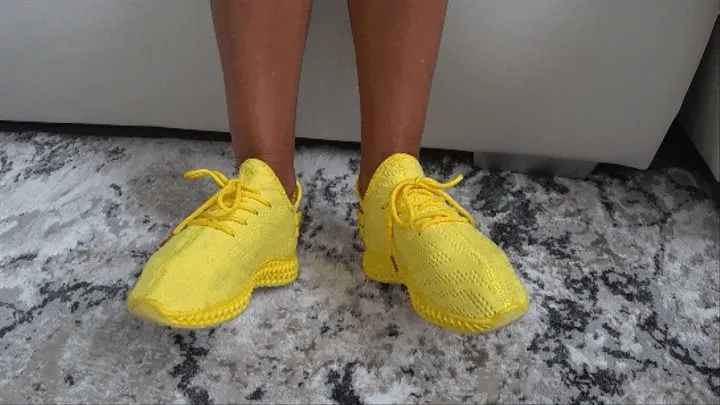 toe wiggleling in yellow soft sneakers a