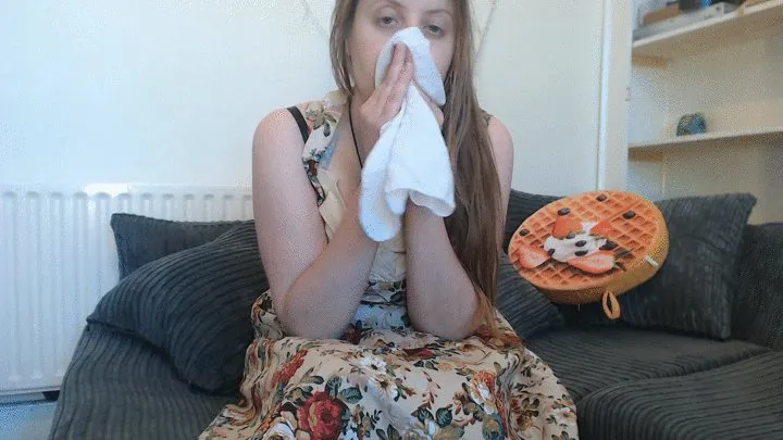 Sneezing in flowery dress