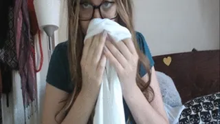 Sneezing and nose blowing into white cloth