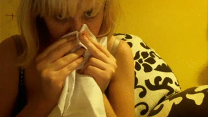 Sneezing and nose blowing into handkerchief