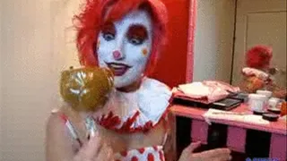 Clown eats a Candy Apple