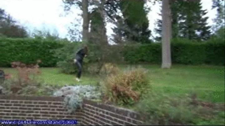 Sarah walking outdoors barefoot in a latex catsuit smoking