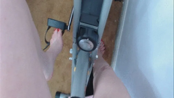 Exercise bike, bare foot POV