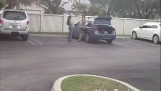 Girl lifting Girlfriend in Parking Lot