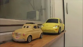 Two volkswagen beetles