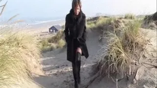 Nanalou walking at the North Sea on a cold windy day.