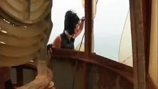 Nanalou visiting a very old lighthouse at the beach in Cabo Verde