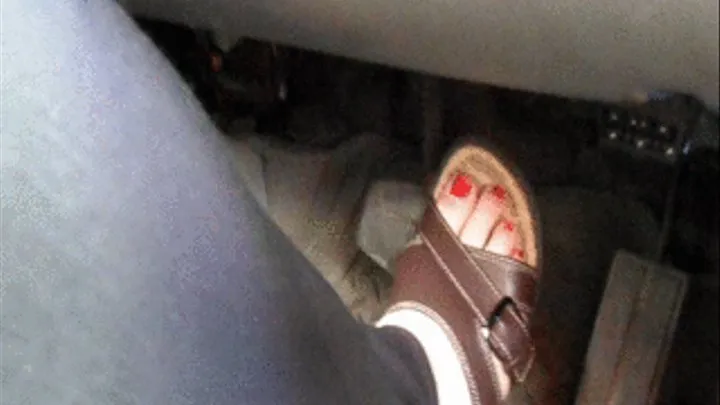 Driving a Ford Expedtion In Brown Sandals