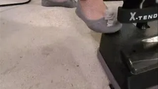 Vacuuming In Gray Slippers