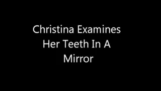 Christina examines her Teeth in the mirror