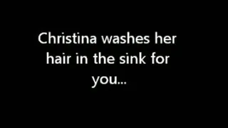 Christina washes her hair in the sink (email)