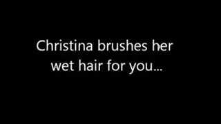 Christina brushes her wet hair