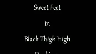 Feet in Black Thigh High Stockings
