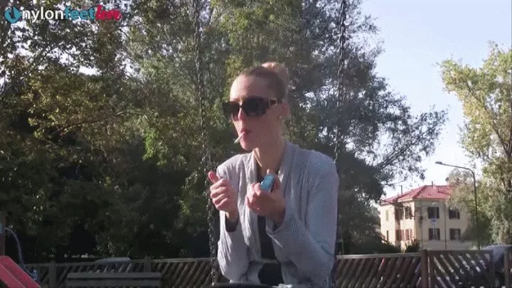 Stunning Christelle playing with her feet while smoking on the swing set HQ