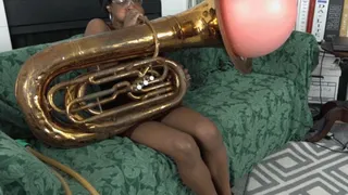 Sierra Struggles to Blow a Hot Water Bottle Inside a Tuba