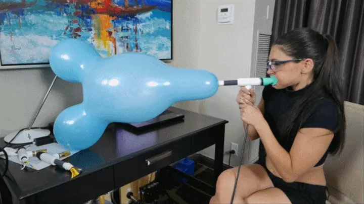 Jade Indica Blows a Mouse Figurine Balloon