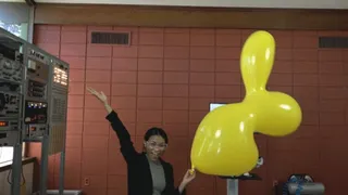 Yoko Blows a Giant Duck Figurine Balloon