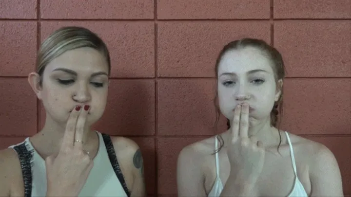 Arietta and Ayla Warm Up Their Faces for a Day of Blowing