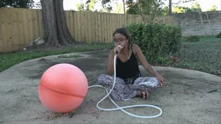 Kiki Blows Up a Chinese Hot Water Bottle Outdoors