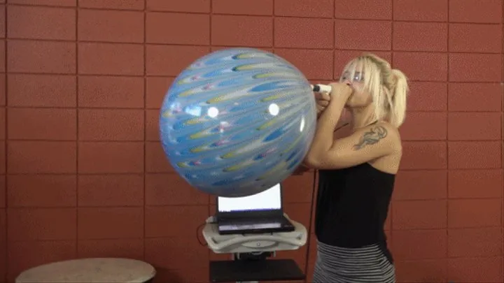Abby Marie Blows a Suzuki Peacock Balloon to Bursting