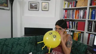 Raquel Atempts to Blow Some Figurine Balloons