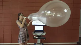 Anastasia Blows Several Round Balloons to Bursting