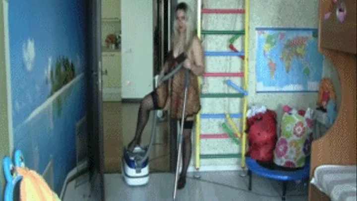 Game with the vacuum cleaner in a nursery