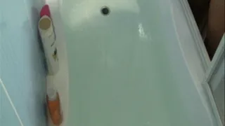 Washing of hair in a bathroom with a large amount of water