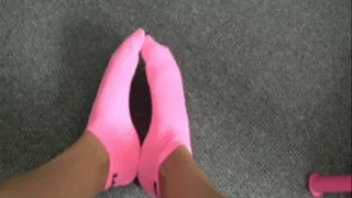 Bright pink socks .