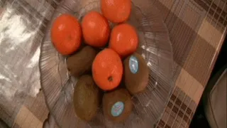 Swallowing whole mandarin also whole kiwi.