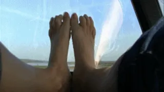 Bare foot in the car.