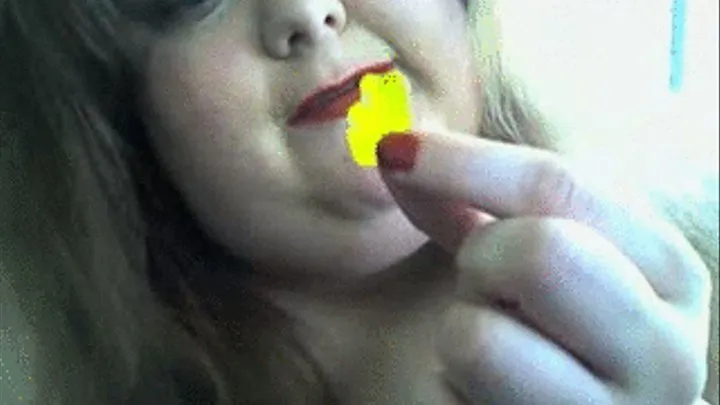 Kitty devours Gummy bears