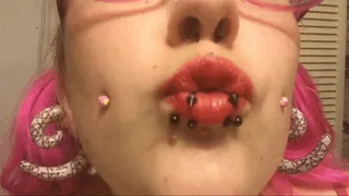 Pierced Mouth applying Red Lipstick