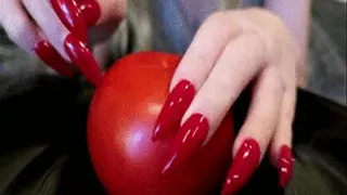 Catwoman Kim tears apart a tomato with her claws!