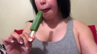 Sucking and licking a popsicle