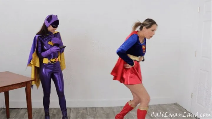 Remote Controlled Heroines: Mesmerized Embarrassment Cosplay starring Nikki Brooks as Supergirl and Cali Logan as Batgirl